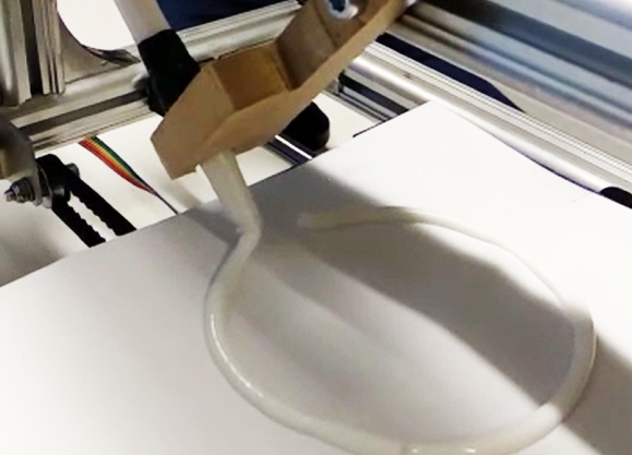 close-up of a liquid being 3d printed. Photo. 