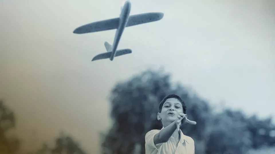 An airplane and a boy. Photo illustration.